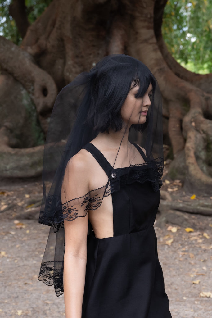 Cross Back Apron Dress in Black